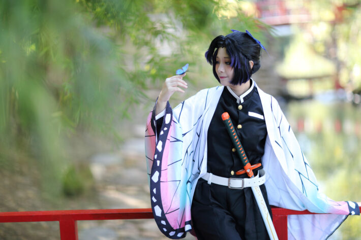 Japan anime cosplay portrait of girl with comic costume with japanese theme garden