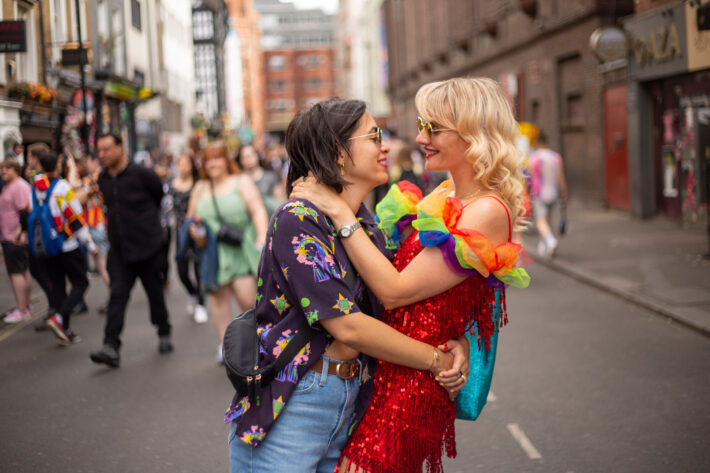 Two women embracing at LGBT parade